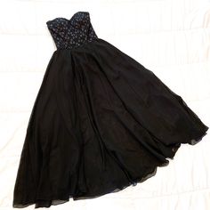 Stunning Black Cinderella Style Formal Dress. Sequin Empire Waist, Strapless Bodice, Floor Length With Sheer Overlay. Size 4. Never Worn. Black Dresses With Fitted Bodice For Prom Season, Black Floor-length Prom Dress, Black Fitted Bodice Dress For Prom, Black Dress With Fitted Bodice For Prom, Black Evening Dresses With Sweetheart Neckline, Black Dress With Sweetheart Neckline For Evening, Black A-line Strapless Dress For Prom, Prom Dress With Sweetheart Neckline And Lining, Black Gown With Fitted Bodice