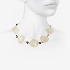 Details Gabriella Kiss 18k yellow gold & mother-of-pearl phases of the moon necklace with blue goldstone, herkimer diamonds, Ethiopian opal, labradorite, amethyst, pyrite, moonstone & 22k beads. The mother-of-pearl full moon measures approximately 1 3/8″ in diameter. The total length of the necklace is 17 1/2″ & it is finished with an 18k clasp. - custom-cut mother-of-pearl - 18k yellow gold - total length 17 1/2" Unique Gemstone Necklace With Mother Of Pearl, Luxury Gemstone Pearl Necklace, Briolette Pearl Jewelry With Natural Stones, Gold Mother Of Pearl Necklace With Gemstone, Gold Necklace With Gemstone And Mother Of Pearl, Gold Necklaces With Gemstone And Mother Of Pearl, Elegant Moonstone Gemstone Beads Jewelry, Elegant Moonstone Necklace With Gemstone Beads, Elegant Moonstone Necklaces With Gemstone Beads