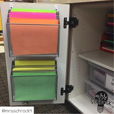 an open cabinet filled with lots of folders