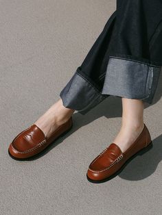 Editor's NotesMOL:pin presents sophisticated footwear that gives off a stylish mood.- Soft and glossy surface loafer- Thick and durable stitch line- Basic and simple loafer design- Soft and durable sheep leather usedMeasurements(in.)- Size: KR 225MM - KR 255MM (US 5.5 - 8.5)- Heel Height: 0.39 in.Composition & Care- Upper: Sheep Leather  Lining: Pig Skin- Natural leather may have fine scratches and wrinkles- Bright leather can get stained by denim or dark outfits- Pen and bond marks may occu Classic Brown Slip-ons For Fall, Classic Flat Loafers With Stitched Sole, Brogue Detail Slip-on Loafers For Work, Classic Flat Slip-ons For Fall, Classic Brown Platform Loafers With Stitched Sole, Brown Platform Loafers With Stitched Sole For Work, Brown Platform Loafers For Work With Stitched Sole, Office Slip-on Moccasins With Stitched Sole, Classic Brown Flat Heel Moccasins