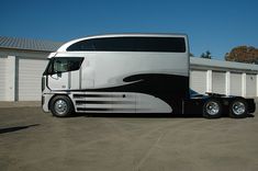 a large semi truck parked in front of a building