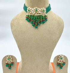 Gold Finish Bright Turquoise Green and Dark Red Beads Kundan Choker Set with Pearls, Mona Lisa Beads, and Stones Festive Jeweled Beaded Necklaces With Round Beads, Traditional Jeweled Beaded Necklaces With Round Beads, Green Beaded Necklaces With Stone Work For Festivals, Festive Green Beaded Necklace With Stone Work, Green Beaded Necklace With Stone Work For Gift, Green Beaded Necklace With Stone Work As Gift, Green Beads For Party And Festivals, Traditional Green Beads For Party, Traditional Green Beaded Bridal Necklace