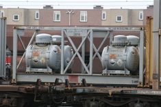 a train car with two propane tanks on it