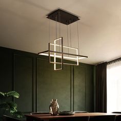 a dining room with green walls and wooden table surrounded by chairs, plants and lights