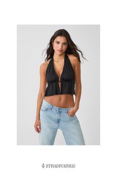 Halter top with a plunging neckline and an open back. Gathered detail below the bust and tied at the back. V-neck Halter Top With Built-in Bra For Vacation, Vacation Tops With Tie Back And Backless Shape, Vacation Tops With Tie Back And Backless Design, Vacation Backless Top With Tie Back, Vacation Tie Back Backless Tops, Chic Triangle Crop Top With Built-in Bra, Trendy V-neck Halter Top For Vacation, Chic Halter Top With Tie Back, V-neck Tie Back Crop Top For Party