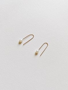 + PEARL U HOOP THREADER EARRINGS +Tiny Fresh Water pearl threader in U shape made with 14k Gold-filled wires. A small drop dangle on your ears that are modern & classic. + Fresh water pearls 4mm+ 14k Gold-filled wire+ Listing is for 1 pair of earrings+ Please allow 5-7 business days to ship out. Everyday White Pearl Drop Threader Earrings, Dainty White Pearl Drop Threader Earrings, White Dainty Pearl Drop Threader Earrings, White Dainty Threader Earrings With Pearl Drop, Minimalist Adjustable Pearl Earrings, Adjustable Minimalist Pearl Earrings, Adjustable Minimalist Pearl Earrings For Pierced Ears, Dainty Adjustable Threader Earrings With Pearl Drop, Minimalist Everyday Pearl Earrings