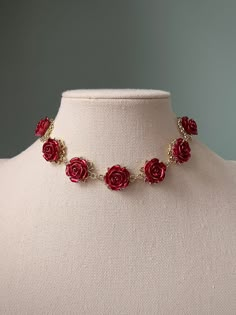 Elegant red rose choker necklace. A perfect treat yourself gift or a gift for a loved one! Necklace chains are made from stainless steel. They are anti-allergic, unfading, nickel and lead free. Rose pendant is made from zinc alloy. Necklace chain is approx. 35cm with 5cm extending chain. Bracelet is approx. 15cm with 3cm extending chain Please do not hesitate to contact me if you have any questions :) Delivery is not tracked. Option to upgrade to tracked delivery can be done at checkout. Luxury Victorian Rose Gold Necklace, Vintage Rose Design Necklaces For Valentine's Day, Party Jewelry With Rose Design In Rose Red, Rose Red Jewelry With Rose Design For Party, Valentine's Day Clavicle Chain Choker, Valentine's Day Rose Design Necklace For Party, Rose Metal Jewelry For Party, Elegant Rose Design Choker Jewelry, Metal Rose Design Jewelry For Valentine's Day