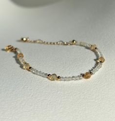 Joy * Positivity * Abundance  - 2mm Citrine beads  - 4mm Citrine beads  - Gold plated  - +2in adjustable chain  Please don't hesitate to contact me if you have any questions!  ☺️ Illuminate your path with our citrine bracelet, a radiant beacon of warmth and optimism. Known for its vibrant golden hues and energizing properties, citrine helps unlock your inner abundance and creativity. Wear this luminous bracelet as a talisman to attract positivity, boost your confidence, and celebrate the joy tha Dainty Yellow Gold Beaded Bracelets With Faceted Beads, Dainty Yellow Gold Beaded Bracelet With Faceted Beads, Adjustable Faceted 14k Gold Filled Bracelets, Adjustable Gold Beaded Bracelets With Gemstone, Adjustable Yellow Gold Beaded Bracelets With Faceted Beads, Elegant Yellow Beaded Bracelets With Gold Beads, Elegant Yellow Beaded Bracelet With Gold Beads, Gold Faceted Beaded Bracelets For Everyday, Gold Beaded Gemstone Bracelets For Jewelry Making