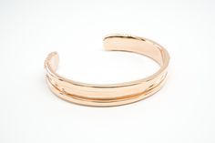 Hair tie bracelet in stainless steel with rose gold ionized plated finish one size, best fits wrists up to 6-6.75" in circumference can accommodate both skinny and thick hair tie elastics This stylish bracelet doubles as a hair tie holder that keeps your wrist indent-free! The Bittersweet hair tie bangle is sure to become your favorite and most useful accessory. Carry a hair elastic on your wrist in a way that’s elegant and versatile whether you are heading to work, dressing up, or working out! Modern Adjustable Rose Gold Bracelets, Adjustable Elegant Rose Gold Cuff Bracelet, Rose Gold Metal Bracelet With Polished Finish, Adjustable Rose Gold Bangle With Polished Finish, Adjustable Polished Rose Gold Bangle, Adjustable Luxury Rose Gold Cuff Bracelet, Luxury Adjustable Rose Gold Cuff Bracelet, Adjustable Modern Rose Gold Bangle, Rose Gold Metal Bangle For Everyday Wear