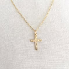 Simple Gold Filled Cross Necklace, First Communion Necklace, Baby Baptism Necklace, Confirmation Necklace, Everyday Necklace, Mom NecklaceAvailable in 14K Gold Filled ONLY.Specification. All component is 14K Gold Filled NOT plated. Cross size 10.2 x 16.4mm. Comes in a satin pouch. Length includes jump ring and claspIMPORTANT:Usually jewellery in the pictures looks bigger than in reality.Please consider all given dimension and compare them to the ruler before ordering.More collections of Religiou Gold Cross Pendant Necklace For First Communion, Personalized Gold Cross Necklace For First Communion, Dainty Gold Cross Necklace For Baptism, Dainty Cross Necklace For Baptism, Gold Cross Pendant Necklace For Baptism, Dainty Cross Pendant Necklace For Baptism, Gold Cross Pendant Jewelry For Confirmation, Personalized Gold Necklaces For Baptism, Yellow Gold Cross Necklaces For Baptism