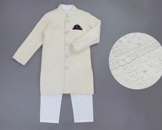 Beautifully hand crafted, this sherwani kurta set will have your little princes fairytale come to life. The jacketis adorned with intricate embroidery work, sequin accents, finished with satin lining on the inside for comfortable wear and a full open button front for easy wear. To complete the look, this Indian/Pakistani long jacket is paired with breathable cotton Kurta and pajama set. Features & Details ►Colors:       Off-White/ Cream with White Kurta Pyjama ►Set of items:       3 piece set in Festive Chikankari Embroidery Bandhgala For Eid, Unstitched Chikankari Bandhgala For Diwali, Unstitched Bandhgala With Chikankari Embroidery For Diwali, Festive Sherwani With Chikankari Embroidery For Eid, Eid Festive Sherwani With Chikankari Embroidery, Festive Eid Sherwani With Chikankari Embroidery, Festive Bandhgala With Chikankari Embroidery, Bollywood Sherwani With Chikankari Embroidery For Eid, Bollywood Sherwani With Chikankari Embroidery