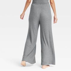 These Cozy Ribbed Wide-Leg Pants from Auden™ will keep you nice and comfy as you lounge about the house. Made from lightweight, super-cozy soft-brushed rib fabric with spandex, these mid-rise pants feature a full elastic waistband with a drawstring to help you find your perfect fit. Cut to an ankle length, they also feature wide, flared legs for a touch of chic style. Auden™: Comfort true to every shape & hue. Comfortable Solid Color Lounge Pants, Solid Color Harem Loungewear Pants, Comfortable Full-length Bottoms, Comfortable Solid Color Wide Leg Sleepwear, Comfortable Pants For Relaxation, Non-stretch High-waisted Bottoms For Loungewear, Comfortable Loose Fit Yoga Pants For Lounging, Non-stretch High-waisted Lounge Pants, Casual Solid Color Sleep Pants