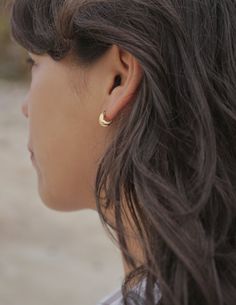 Solid cast hoop earrings with an organic rough textured surface. A nice simple minimal statement earring or for additional piercings layered with other styles. Gold Vermeil (14k gold over sterling silver) made with recycled materials Handmade in the USA using sustainable earth-friendly materials. CARE: Most metals will naturally patina over time, however, there are measures you can take to prolong the life of your jewelry. We recommend removing all jewelry prior to showering, swimming, cleaning, Everyday Recycled Gold Huggie Earrings, Minimalist Recycled Gold Huggie Earrings, Minimalist Everyday Brass Huggie Earrings, Everyday Minimalist Brass Huggie Earrings, Everyday Single Earring In Recycled Gold, Minimalist Single Hoop Earring In Recycled Gold, Gold Crescent Hoop Earrings For Everyday, Everyday Gold Crescent Hoop Earrings, Dainty Brass Hoop Earrings For Everyday