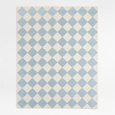 a blue and white checkered rug on a white floor with an area rug in the middle