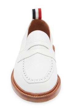 A tricolor grosgrain pull loop brings the label's signature flair to this calfskin-leather loafer detailed with classic broguing at the apron toe. Leather upper and lining/leather and synthetic sole Made in the UK Designer Shoes Classic Cap Toe Loafers With Textured Sole, White Cap Toe Leather Shoes For Work, White Brogue Dress Shoes For Work, Workwear Wingtip Tassel Loafers In Calf Leather, White Leather Shoes With Brogue Detailing For Work, White Wingtip Leather Shoes For Work, White Brogue Leather Shoes For Work, Wingtip Tassel Loafers With Brogue Detailing In Calf Leather, Classic Wingtip Tassel Loafers With Textured Sole