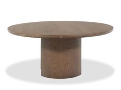 a round wooden table with an oval base