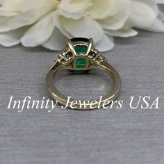 "This ring is an elongated cushion cut lab created green emerald with moissanite accents made with solid 14k yellow gold item #6650 We feature the finest quality lab grown emeralds in the world. The properties of lab-grown are physically, chemically and visually identical to natural, just grown in a lab setting. Emerald is the birthstone of May -Approximate total carat weight: 3.80ctw diamond equivalent -Center Stone Size: 10x8mm approx. 3.50ct diamond equivalent -Center Stone Shape: elongated c Oval Emerald Ring With Prong Setting, Green Emerald Anniversary Ring, Green Baguette Cut Jewelry With Accent Stones, Gia Certified Rectangular Emerald Ring For Anniversary, Gia Certified Emerald Anniversary Ring, Formal Emerald Birthstone Ring In Rectangular Shape, Gia Certified Emerald Ring For Anniversary, May Birthstone, Gia Certified Emerald Anniversary Ring May Birthstone, Oval Emerald Ring As A Gift