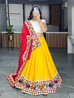 Celebrate Navratri in style with our exquisite Navratri Garba Lehenga Choli Set. This stunning traditional Indian outfit is designed to add a burst of color and elegance to your Navratri festivities. Featuring printed lehenga choli in heavy Butter silk. It has 4 mtr flair Skirt and blouse both are stitched.  Lehenga length is 40 to 42  inches. blouse is 34 to 42 inches Navratri Bohemian Chanderi Anarkali Set, Bohemian Chanderi Anarkali Set For Navratri, Traditional Anarkali Set With Gota Work For Navratri, Traditional Chanderi Anarkali Set For Navratri, Bohemian Sets With Gota Work For Navratri, Bohemian Anarkali Set With Gota Work, Embroidered Lehenga For Traditional Ceremonies And Navratri, Multicolor Anarkali Set For Traditional Ceremonies During Eid, Chanderi Lehenga With Dori Work For Navratri