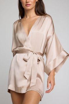 Luxurious and silky. This is elevated loungewear. A luxurious 100% silk kimono-style mini robe that drapes without effort and doesn't cling. *411* Use this as a guide. Preference is a huge factor — if you’re near the top of a size range and/or prefer more coverage, you may want to size up. Features a sleek drop kimono-inspired sleeve with a double cuff and light ruching on the shoulder for extra fullness. Short mini length. Finished with french seams, internal ties to hold garment in place, and Plus Size Silk Robe, Short Silk Robe, Silk Pijamas, Elevated Loungewear, Sleepwear Women Nightgowns, Elegant Loungewear, Silk Robes, Silky Robe, Silk Nightwear