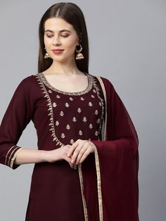 PRODUCT DETAILS Maroon embroidered Kurta with Palazzos with dupattaKurta design: Geometric embroidered Straight shape Regular style Round neck, three-quarter regular sleeves Gotta patti detail Calf length with a straight hem Cotton blend machine weave fabric Palazzos design: Embroidered Palazzos Elasticated waistband Slip-on closure Comes with dupatta Size & Fit Dupatta length: 2.25 metersDupatta width: 95 cmThe model (height 5'8) is wearing a size S Please check the last image above for a compl Dola Silk Straight Kurta With Embroidered Border, Straight Dola Silk Kurta With Embroidered Border, Dola Silk Anarkali Set With Embroidered Border, Designer Churidar With Embroidered Border, Embroidered Chinon Churidar For Navratri, Festive Dola Silk Kurta With Embroidered Border, Embroidered Dola Silk Fabric For Straight Kurta, Semi-stitched Embroidered Chinon Churidar, Festival Embroidered Chinon Churidar