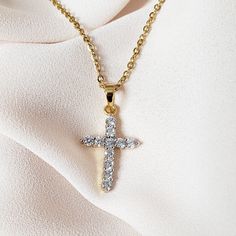 Our Medium Crystal Cross Necklace is the perfect statement piece to add just the right amount of sparkle to your outfit. MATERIAL: 24K gold plating; stainless steel; cubic zirconia crystals ✔ Non Tarnish ✔ Hypoallergenic ✔ Handmade ✔ Quality Guaranteed COLOR: gold Dainty Gold Rhinestone Jewelry, Gold Crystal Charm Necklace With Clavicle Chain, Gold Rhinestone Necklace With Clavicle Chain, Dazzling Gold Crystal Necklaces With Sparkling Stones, Gold Cubic Zirconia Crystal Pendant Necklace, Gold Dainty Crystal Necklace With Cubic Zirconia, Dainty Gold Jewelry With Rhinestones, Gold Cubic Zirconia Pendant Necklace, Gold Dainty Cubic Zirconia Crystal Necklace