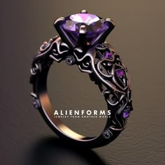 an intricately designed ring with a purple stone