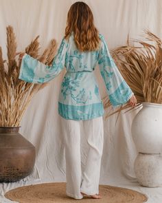 Feel the softness of summer with our Bohemian Breeze Modal Kimono! This sustainable style stunner boasts organic fabrics and a luxurious look that's perfect for sunny days. With an endless sunset color, you'll be radiating every day! Spring V-neck Tunic For Loungewear, Elegant Long Sleeve Sleepwear For Vacation, Flowy Casual Tunic For Loungewear, Casual Flowy Tunic For Loungewear, Chic V-neck Sleepwear For Spring, Flowy Viscose Tunic, Versatile Summer Tunic With Relaxed Fit, Summer Tops With Kimono Sleeves For Daywear, Viscose Sleepwear For Summer