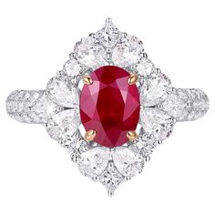 This extraordinary ring showcases a GIA-certified 1.30-carat Burma ruby, renowned for its vivid red hue and exceptional quality. The oval-cut ruby, ethically sourced from the legendary mines of Burma (Myanmar), serves as the centerpiece of this luxurious creation. Its rich and intense color is a hallmark of the finest rubies, offering a timeless elegance that captivates the eye. Encircling the ruby is a halo of 0.66 carats of brilliant-cut diamonds, meticulously arranged to enhance the gemstone' Gia Certified Ruby Ring, Exquisite Ruby Ring, Luxury Gia Certified White Gold Ruby Ring, Luxury Oval Diamond Ring With Lab-created Ruby, Exquisite Brilliant Cut Ruby Diamond Ring, Exquisite Gia Certified Ruby Diamond Ring, Luxury Ruby Halo Ring, Luxury Red Ruby Gemstone Ring, Luxury Ruby Cluster Ring With Gemstones