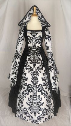 This listing is for a custom made dress, it will be made to the measurements you send me. Please send me your bust, waist and hip measurement, and please measure from the top of your shoulder to the floor with shoes on. It will be made with beautiful jet black crushed velvet and stunning white & black flocked taffeta. It has a corset style front and back with black lacing so you can adjust the dress to fit your body shape. Combined shipping on multiple items. If you purchase express shipping by courier please send me your phone number thank you. Black Wedding Gown With Boned Bodice, Black Gothic Wedding Gown, Black Floor-length Gown For Costume, Black Floor-length Costume Gown, Black Gown With Fitted Bodice For Costume Party, Black Ball Gown With Boned Bodice, Fitted Gothic Gown For Costume, Gothic Fitted Gown For Costume, Gothic Ball Gown For Wedding