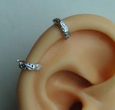 "Textured Pierced Ear-cuff / Helix Cuff Earring / Floral Sterling silver cuff /Small ear cuff / Sterling ear cuff / Scalloped ear cuff / 2 ear cuff so you can wear it anywhere you like.   I can do this shiny or darken it. These are handmade by me and are slightly different sizes. The design is textured with a hint of flowers.  This is a great earring for a man or woman. Measurements- Conch 10mm (3/8\") ID or lobe earrings 1/2\" This listing is for 2 earrings.        Helix 7mm (1/4\") ID   The po Elegant Silver Internally Threaded Hoop Earrings, Adjustable Pierced Metal Cartilage Earrings, Silver Clip-on Cartilage Earrings As Gift, Silver Clip-on Cartilage Earrings For Gift, Adjustable Metal Cartilage Earrings, Adjustable White Gold Hoop Earrings, Adjustable Metal Hypoallergenic Ear Cuff, Adjustable Hypoallergenic Metal Ear Cuff, Silver Clip-on Metal Cartilage Earrings