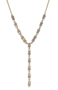 Anchor your stack in serious shine wit this dainty Y-necklace fronted by clusters of cubic zirconia. Rhodium plate or 18k-gold plate/cubic zirconia Imported Gold Lariat Cubic Zirconia Diamond Necklace, Gold Lariat Diamond Necklace With Cubic Zirconia, Gold Cubic Zirconia Lariat Diamond Necklace, Gold Cubic Zirconia Lariat Necklace, Gold Cubic Zirconia Lariat Necklaces, Gold Cubic Zirconia Lariat Backdrop Necklace, Elegant Gold Crystal Lariat Necklace, Gold Crystal Lariat Necklace, Gold Crystal Backdrop Necklace With Adjustable Chain