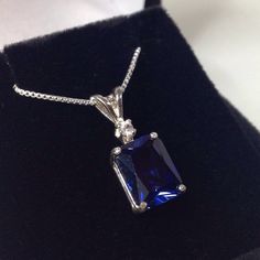 "Beautiful Blue & White Sapphire Pendant Necklace * 4ct Emerald Cut Blue Sapphire measures 10mm x 8mm * Brilliant Cut White Sapphire Accent measures 2.5mm * 4.1cts total gemstone weight * 14k White or Yellow Gold * 18\" Sterling Silver link Chain Included Hallmarked & Gift Ready! Matching Earrings & Ring Also Available! This 4ct Sapphire is Laboratory Grown & is identical to natural in every way, including Chemistry, Composition & Hardness with Excellent Clarity & Color R Radiant Cut Sapphire Fine Jewelry, Radiant Cut Lab-created Sapphire Jewelry, Exquisite Sapphire Cubic Zirconia Jewelry, Formal Emerald-cut Solitaire Necklace In Cubic Zirconia, Formal Emerald Cut Solitaire Necklace With Cubic Zirconia, Elegant Sapphire Necklace With Emerald Cut, Dazzling Sapphire Jewelry For Formal Occasions, Diamond White Sapphire Jewelry Gift, Sapphire Jewelry With Brilliant Cut Cubic Zirconia