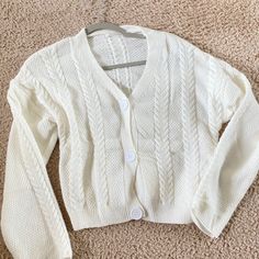 White Cardigan Sweater - Crop Top Size M/L Never Worn Orig Price 60$ White Buttoned Sweater For Spring, White Casual Cardigan With Buttons, White Cardigan With Button Closure For Fall, Spring White Buttoned Sweater, White Sweater With Buttons For Day Out, White Buttoned Sweater For Day Out, Trendy White Sweater With Button Closure, White Button Sweater For Day Out, Casual Cream Sweater With Button Closure