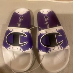 Kids Brand New White/Purple And Black Champion Slides Casual Purple Non-slip Sneakers, Casual Non-slip Purple Sneakers, Comfortable Purple Sneakers With Round Toe, Purple Synthetic Sneakers For Summer, Purple Synthetic Summer Sneakers, Summer Purple Synthetic Sneakers, Casual Purple Closed Toe Sneakers, Trendy Purple Sneakers For Summer, Comfortable Purple Summer Sneakers