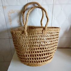 "Sisal bag,African bag,African purse It is handwoven by Kikuyu and kamba women. This bag can be for everyday use eg shopping. Perfect gift for her. Material: sisal It's 10\" wide ×8tall. Ship via dhl express. Thank you for visiting" Straw Tote Bag With Braided Handles As Gift, Tote Straw Bag With Braided Handles As Gift, Natural Color Crochet Bag With Braided Handles As Gift, Natural Crochet Bag With Braided Handles As Gift, Brown Large Capacity Straw Bag As A Gift, Brown Large Capacity Straw Bag For Gift, Rectangular Straw Bag For Daily Use With Weaving, Large Handmade Natural Shoulder Bag, Basket Shoulder Bag With Braided Handles As Gift