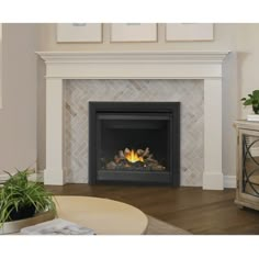 a white fireplace with a fire in it