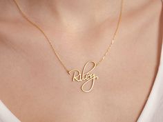 "Introducing our Dainty Script Name Necklace, a delicate and personalized accessory that embodies elegance. This necklace features your chosen name beautifully crafted in a graceful script font. The dainty design adds a touch of sophistication, making it perfect for everyday wear or special occasions. Made with high-quality materials, it offers both durability and timeless beauty. This Dainty Script Name Necklace is a thoughtful and unique gift that celebrates individuality and holds a special p Name Pendant Necklaces For Weddings, Wedding Necklaces With Names On Pendant, Wedding Name Pendant Necklace, Wedding Pendant Necklace With Names, Minimalist Name Necklaces For Wedding, Minimalist Necklaces With Names For Wedding, Elegant Name Necklace For Gifts, Adjustable Name Necklaces, Elegant Adjustable Wedding Name Necklace