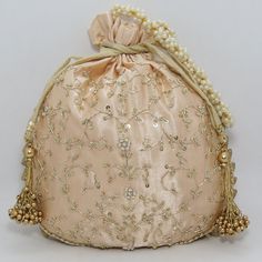 "traditional indian golden zardosi sequin embroider wedding giveaway bag potli | beautiful handmade gifting drawstring purse for woman Package Contents: 1 Size: 10\" x 8\" Designed with the heart, this beautiful Potli or batawa bag are eye catchy and made of premium material. Key Features: Zardosi embroidery art work. This potli is good match with both Indian and western outfits and are superb for wedding and festive parties. This would be best complement to your designer saree, lenhga or any ot Gold Bollywood Style Potli Pouch Bag, Gold Handwork Potli Bag, Bollywood Style Gold Potli Pouch Bag, Bollywood Style Gold Potli Bag, Bollywood Style Gold Potli Pouch, Gold Zari Work Potli Bag For Gift, Traditional Gold Potli Bag For Festivals, Traditional Gold Potli Bag For Navratri, Gold Potli Bag For Navratri Party