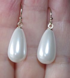 Being offered is a fabulous 14K GOLD FILLED WHITE 30MM TEAR DROP WHITE COATED JAPANESE PEARL EARRINGS  THESE PEARLS ARE NEW OLD STOCK PEARLS MADE IN JAPAN IN 1950'S  THESE OLD STOCK PEARLS  HAVE INCREDIBLE LUSTER AND ARE MEDIUM SIZE  EARRINGS COATED JAPANESE PEARLS ARE FAMOUS MAN MADE PEARLS / QUALITY AND LUSTER THEY ARE NEW OLD STOCK FROM HOBE COMPANY. I HAVE FEW PAIRS.  PLESAE SEE PHOTOS. QUALITY PEARL TEAR DROPS. THE WHOLE EARRINGS DROPS ARE 30 MM/ 1.20 INCHES /  2.1 GRAMS INCREDIBLE LUSTER AND SHINE / 14K SOLID GOLD EAR WIRES  IF YOU WANT SOMETHING LARGE AND YET WEIGHT LIGHT, THESE ARE FOR YOU. YOU WILL LOVE WEARING THEM.Privacy policy, return policy; If you are returning the merchant just because you did not like it, you will have to pay for return ship. option 1 ; you can either have White Pear-shaped Party Jewelry, Classic White Pearl Earrings For Party, White Teardrop Pearl Earrings For Party, White Drop Pearl Earrings For Party, White Drop Teardrop Earrings For Party, White Teardrop Earrings For Party, Elegant White Teardrop Earrings For Gift, Elegant White Hypoallergenic Teardrop Earrings, Formal White Hypoallergenic Teardrop Earrings