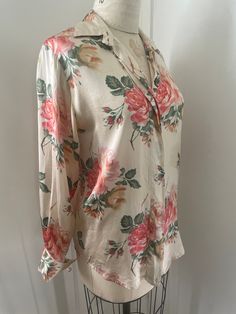 100% Silk oversize cabbage rose pattern blouse from authentic vintage Ann Taylor  Has a discoloration that I haven't tried to remove. May come out at the cleaners but it camouflages easily  into the design so not that big of a deal imo. Detail in pic. Labeled size 4 Measurements taken flat double when necessary  Shoulder to shoulder 16" Pit to pit 21" Sleeve length 24" Shoulder to hem 27" Due to the nature of vintage, all items in my store are sold as is. All sales are final without exception, I have a no returns/refunds policy. However, please contact me if there is a problem with your order. Please refer to the FAQs at the bottom of the page of my main store for my shop policies. By purchasing from my shop you are agreeing to my shop policies. Luxury Vintage Printed Blouse, Spring Floral Print Blouse With Spread Collar, Casual Blouse With Floral Print And Spread Collar, Classic Collared Top With Floral Print, Classic Collared Tops With Floral Print, Classic Floral Print Button-up Shirt, Classic Long Sleeve Blouse With Floral Print, Classic Long Sleeve Floral Print Blouse, Classic Button-up Shirt With Floral Print