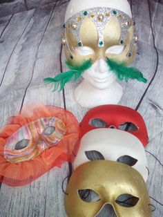 "This is a beautiful lot of vintage masquerade eye masks a couple of which were made in Italy. They measure approximately 7 1/2\" x 4 1/4\". There are two ornate, decorated masks as follows: Gold with Green feathers and green, yellow, and gold faceted faux gems attached Multi-color pastel swirl in pinks and silver, orange and purple, with orange and red tulle fabric There are 3 simpler masks: Gold. Red, and White. The red and gold masks are marked \"Made in Italy\" on the inside. This is great V Venetian Masks For Mardi Gras Carnival, Festival Masks And Prosthetics As Gifts, Mardi Gras Masks And Prosthetics, Venetian Masks For Mardi Gras Gift, Venetian Masks For Mardi Gras, Venetian Eye Mask As A Gift, Multicolor Masquerade Mask For Carnival Festivals, Multicolor Masquerade Mask For Carnival, Multicolor Masks And Prosthetics For Masquerade And Carnival