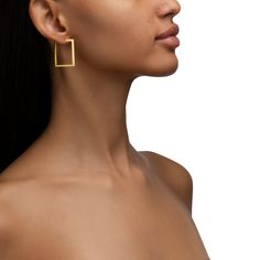 Simple and strong, the clean lines on these stunning medium 30mm square hoop earrings in 18K yellow gold cut a dashing silhouette to complement the curves of your jawline. The 2mm thickness of these timeless hoops gives them a delicate quality while the ninety-degree corners are visually strong, symbolic of the elegance of feminine strength. Elegant Square Huggie Earrings, Modern Square Yellow Gold Hoop Earrings, Elegant Yellow Gold Square Huggie Earrings, Elegant Square Yellow Gold Huggie Earrings, Yellow Gold Square Hoop Earrings For Everyday, Hoop Earrings Medium, Square Hoop Earrings, Feminine Strength, Gold Hoop