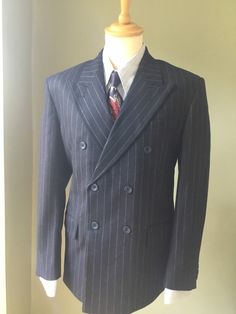 "An exact copy of post 1941 CC41 suit that is correct in every detail. This is made from 100%  wool in a beautiful flannel and is available as a three  piece suit. The suit jackets are available in sizes 40″ -50″  the 40″  jacket comes with  34\" trousers which can be let out or taken in  to a maximum of 2\" either way. The trousers then go up in 2\" sizes with the corresponding jacket 42\" jacket with 36\" trousers on so on to maximum of 42\" trousers. The trousers also come with an unfinished Classic Long Sleeve Pinstripe Suits, Pinstripe Double Breasted Suit With Long Sleeves, Double-breasted Pinstripe Blazer For Tailoring, Pinstripe Double-breasted Tailoring Blazer, Pinstripe Suits With Lapel Collar For Business, Pinstripe Business Suits With Lapel Collar, Classic Double-breasted Pinstripe Outerwear, Striped Double Breasted Suit With Double Button For Semi-formal, Classic Pinstripe Blazer With Lapel Collar