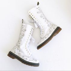 Vonda//1c57 14 Hole Tall White Boots With Trailing Roses Tooled/Etched Into The Leather. Dr Martens Authentic Docs. Would Be Amazing For A Bride, Bridal Shower, Wedding, Bacherlorette, Trendy Or Just Cus You Want Some Gorgeous Boots. ** Several Scuffs Overall, There Is A Chunk Missing Out Of The Edge Of One Boot And A Chunk Missing Out Of The Top Near The Vamp. There Is Some Glue Discoloration On The Interior. ***No Original Doc Marten Laces. The Laces Are Ribbon Laces That Were Added By Me. Sin Bridal Hiking Boots, Bridal Doc Martens, White Fitted Boots With Flat Heel, Fitted White Boots With Flat Heel, White Lace-up Boots For Wedding, White Laced Boots For Spring, White Round Toe Boots For Wedding, White Round Toe Wedding Boots, White Closed Toe Wedding Boots