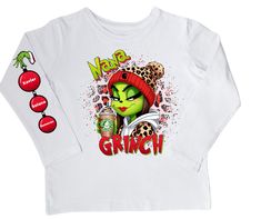 This Grinch Nana/Tata shirt brings the holiday spirit to your wardrobe! Its festive design and cozy fabric will have you feeling merry and bright all season long! Crafted from comfortable and durable material, this shirt will make a perfect addition to your holiday wardrobe. Let the Grinch bring cheer to your style this year! Winter Holiday Long Sleeve T-shirt, Red Long Sleeve Top For Gifts, Christmas Festive Long Sleeve Tops, Festive Long Sleeve Tops For Christmas, Festive Long Sleeve White T-shirt, Holiday Long Sleeve Cotton Top, Cotton Long Sleeve Holiday Top, Cotton Long Sleeve Top For Holidays, Long Sleeve Cotton Top For Holiday