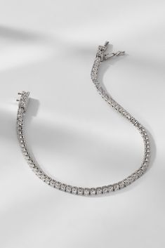 A style staple, this elegant tennis bracelet adds a touch of elegance to any outfit. Classic and timeless, this essential accessory seamlessly stacks with other bracelets or adds a pop of sparkle and shine all on its own. Shop all Perfect Tennis styles here. Silver Tennis Bracelet With Prong Setting For Everyday Luxury, Luxury Silver Tennis Bracelet With Jubilee Style, Silver Diamond Cut Tennis Bracelet For Everyday Luxury, Fine Jewelry Silver Tennis Bracelet For Everyday Luxury, Silver Tennis Bracelet For Everyday Luxury, Timeless Silver Tennis Bracelet With Diamond Accents, Silver Diamond Tennis Bracelet For Everyday Luxury, Silver Cubic Zirconia Flexible Tennis Bracelet, Silver Cubic Zirconia Tennis Bracelet