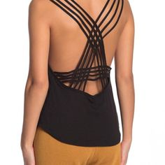 A Strappy Racerback Looks Ultra-Chic On This Sleeveless Valentine Casual Tank Top. - Crew Neck - Sleeveless - Strappy Racerback - Ribbed Trim - Knit Construction Shell: 50% Polyester, 25% Rayon, 25% Cotton Rib: 55% Cotton, 35% Polyester, 10% Rayon Casual Cross Back Tank Top With Built-in Bra, Casual Tank Top With Built-in Bra And Strappy Back, Black Tank Top With Built-in Bra And Strappy Back, Black Top With Built-in Bra And Strappy Back, Black Tops With Built-in Bra And Strappy Back, Chic Black Strappy Back Halter Top, Chic Black Halter Top With Strappy Back, Black Stretch Backless Camisole, Black Tank Top With Tank Straps For Yoga