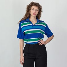 Vintage 90s blue polo shirt with light blue, white, and green horizontal stripes. Fits unisex. Measurements and Condition: Fits like: Labeled large (men's sizing), can also fit women's XL Fabric: Cotton/poly Brand: Great Northwest Sportswear, made in USA Condition: Very good, with a tiny hole on the front of left sleeve, and five tiny holes on the lower back left next to the hem. Length: 27" Chest: 44" Shown on a 5'8" model with measurements of 34"-26"-37", usually wears size small to medium. See our FAQ section for more information on sizing and condition ratings. Blue Polo Shirt With Striped Collar, Vintage Blue Collared T-shirt, Summer Striped Relaxed Fit Polo Shirt, Striped Relaxed Fit Polo Shirt For Summer, Retro Polo Shirt With Relaxed Fit, Retro Relaxed Fit Polo Shirt With Polo Collar, Striped Shirt With Polo Collar For Spring, Retro Relaxed Fit Polo Shirt, Striped Relaxed Fit Collared Polo Shirt