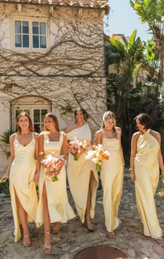 the bridesmaids are all dressed in yellow dresses