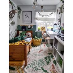 a bedroom decorated in green, yellow and white with lots of plants on the wall